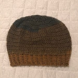 Handmade Crochet hat. Never worn. Multiple browns greens and golds in color.